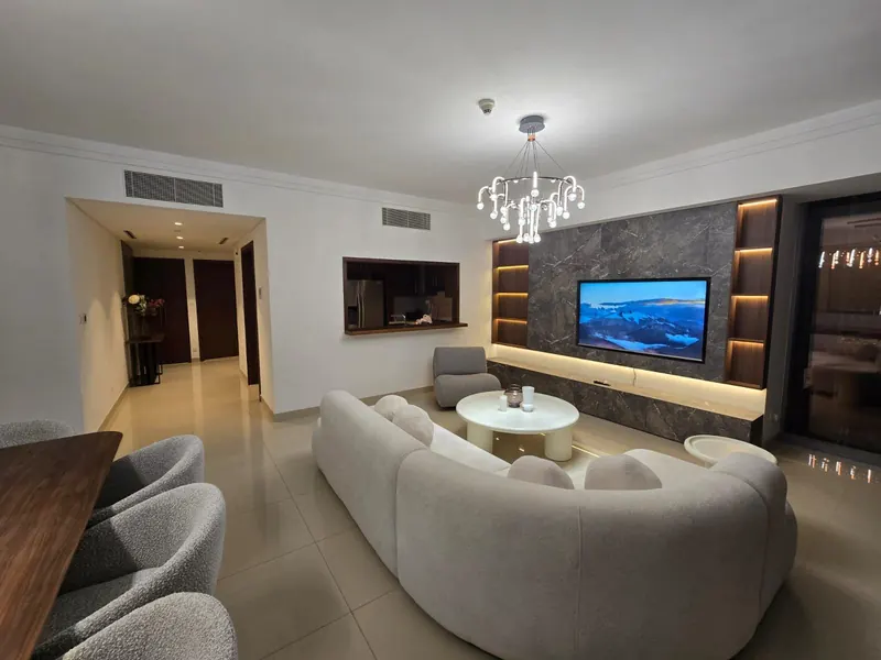 Furnished four-bedroom living room by Nuwah Interiors